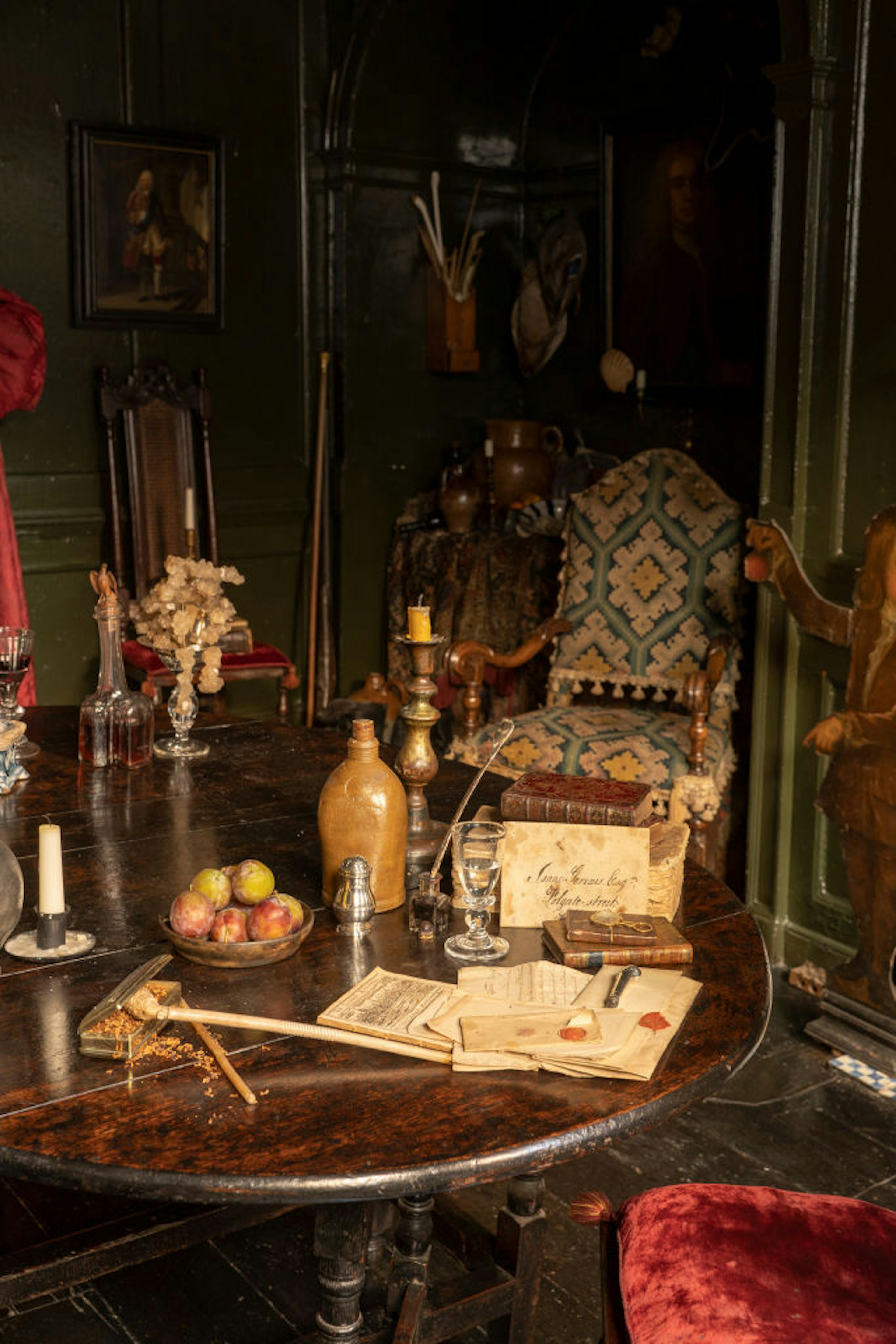 A table with food and notebooks designed to look like a historic building.