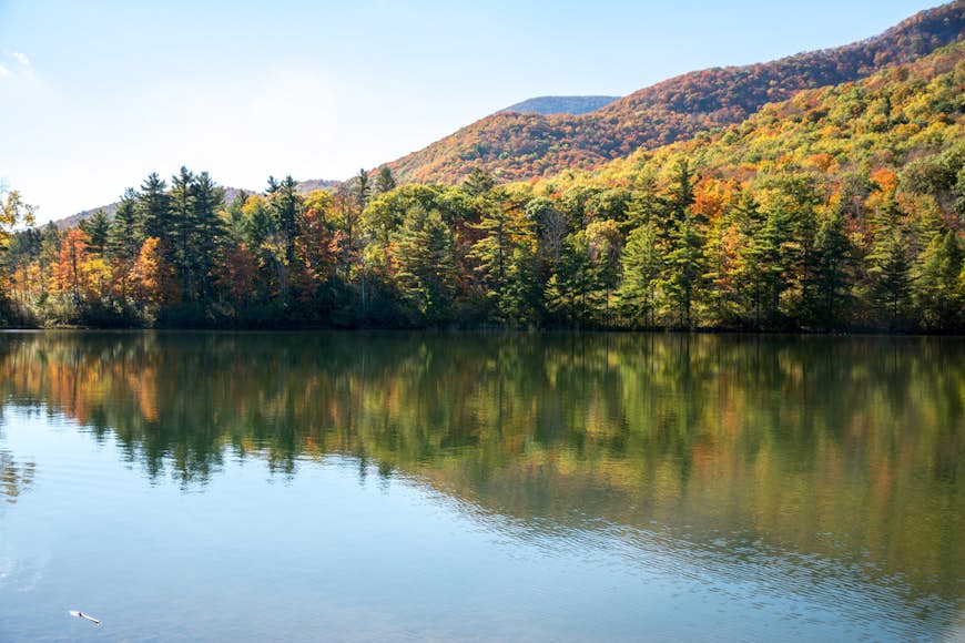 Fall foliage and its reflection at Equinox pond in Manchester, Vermont