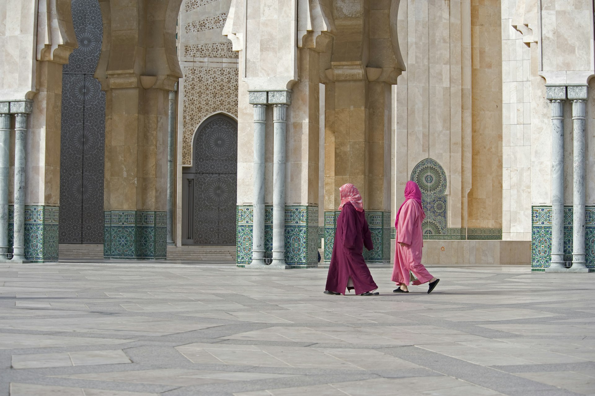 Two women walk in Hasan II Mosque in Casablanca, Morocco