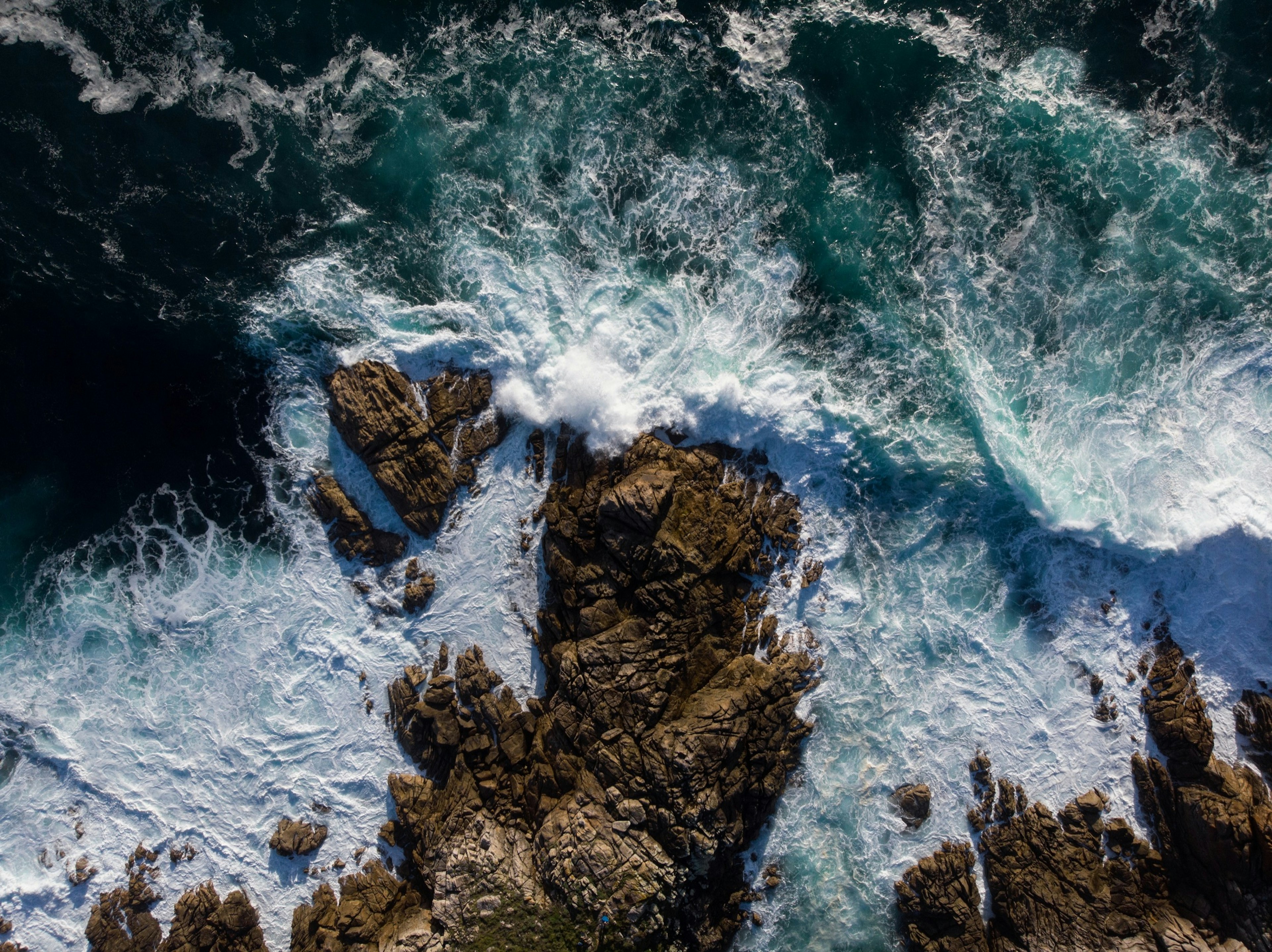 Aerial,Panorama,Of,Waves,Crashing,On,Rocky,Coast,Shore,At