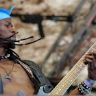 Spencer Thrust, guitarist of the Death Metal band Overthrust from Botswana, performing at the Wacken Open Air in Wacken, Germany, 5 August 2016. 75,000 fans are attending what organisers say is the largest heavy metal festival in the world. PHOTO: AXEL HEIMKEN/dpa | usage worldwide   (Photo by Axel Heimken/picture alliance via Getty Images)
