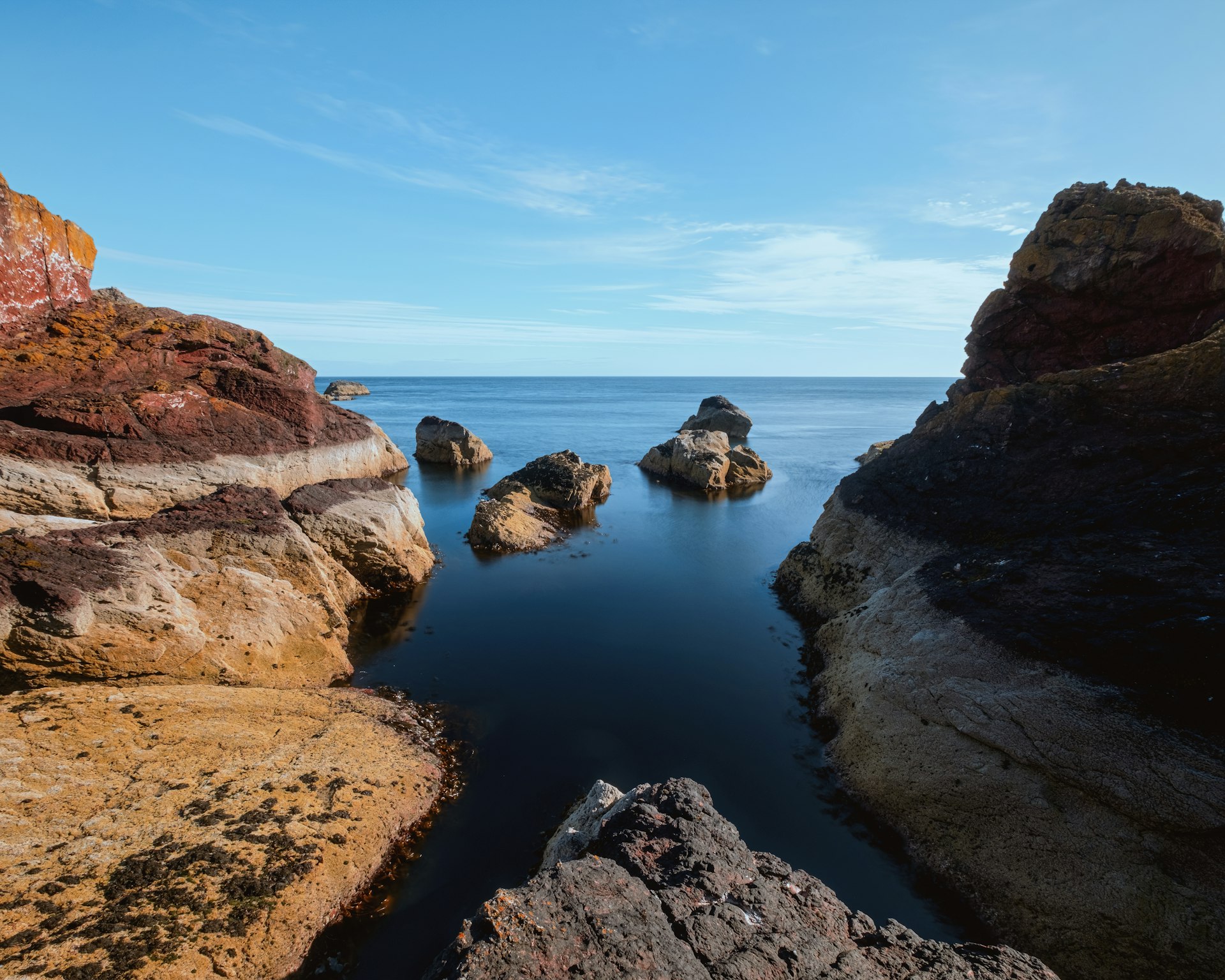 Scottish seashore with cliffs. St Abb's Head National Nature Reserve on the Berwickshire coastline, Scotland, UK