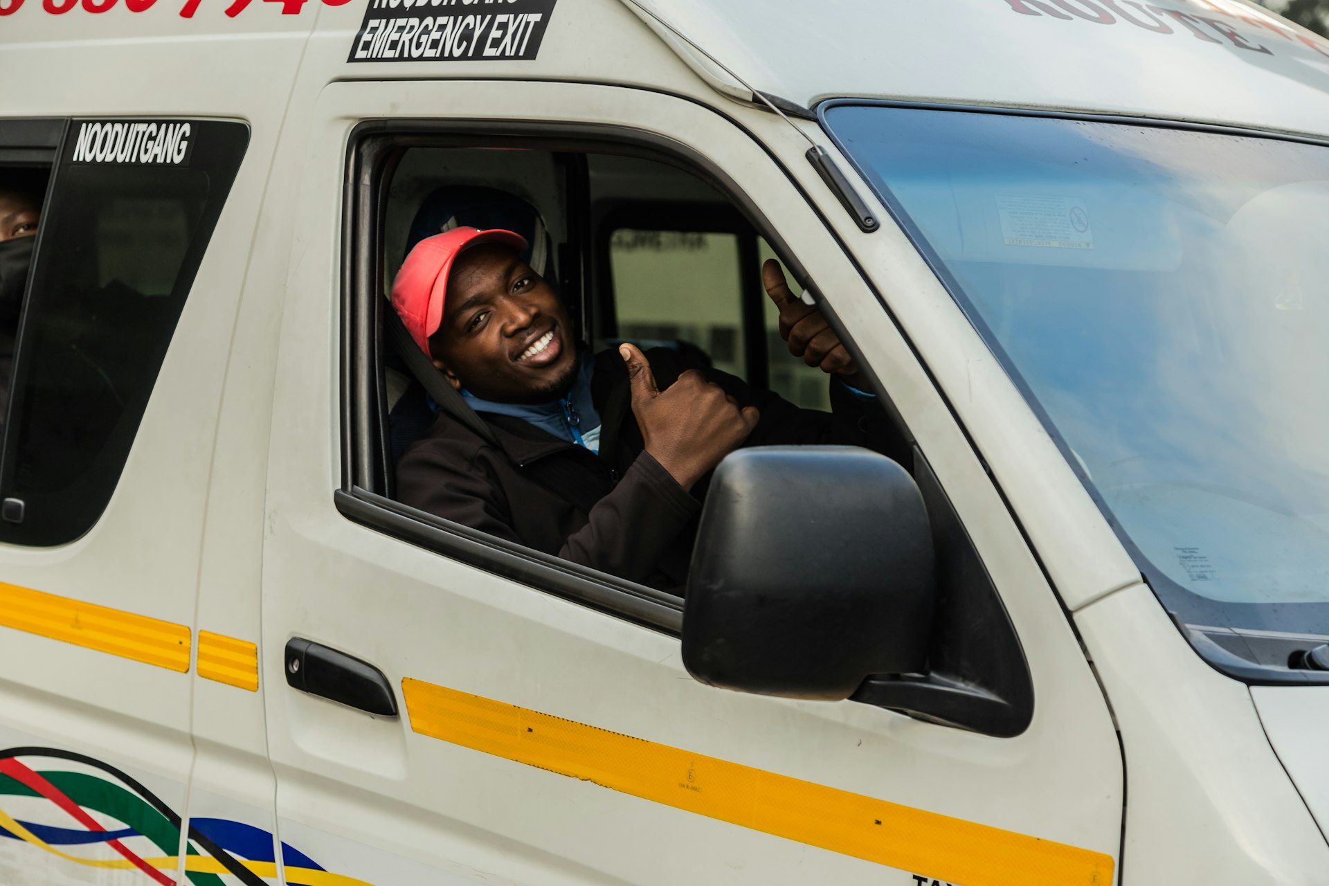 frican Taxi driver driving passengers during Corona Virus Pandemic in South Africa