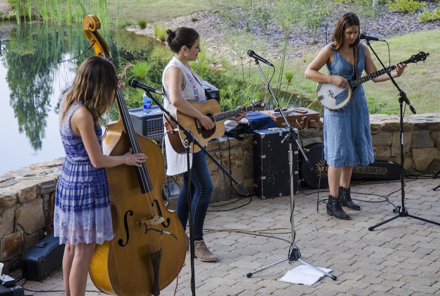 An outdoor bluegrass concert at Daniel Stowe Botanical Garden in Belmont, NC