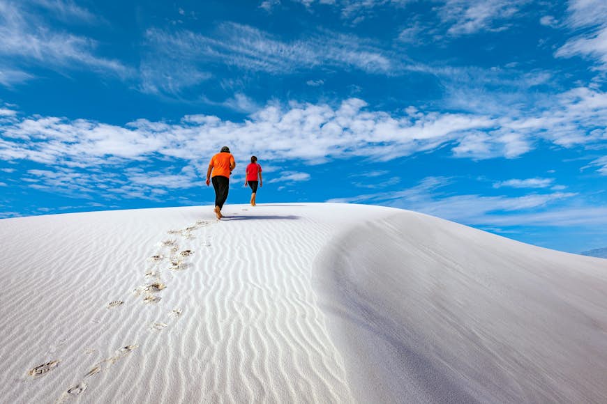 Young hikers walking in a white desert, New Mexico, USA