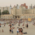 Montevideo, Uruguay - 11th January 2022 - Beautiful sunset on Ramyres beach with bathers on a summer day in Montevideo Uruguay.; Shutterstock ID 2121221777; your: Sloane Tucker; gl: 65050; netsuite: Online Editorial; full: Montevideo Things to Do Article
