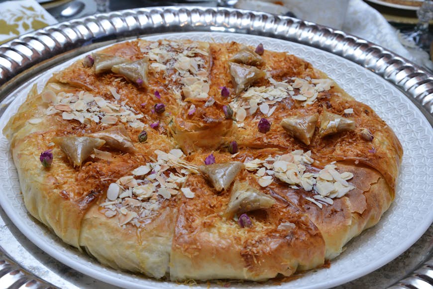 Bastila or `Pastilla` is a taraditional moroccan dish. Chicken Bastila is a pie filled with chicken, eggs,onions, sugar. In some regions of Morocco, it is typically made with pigeon meat or fish.