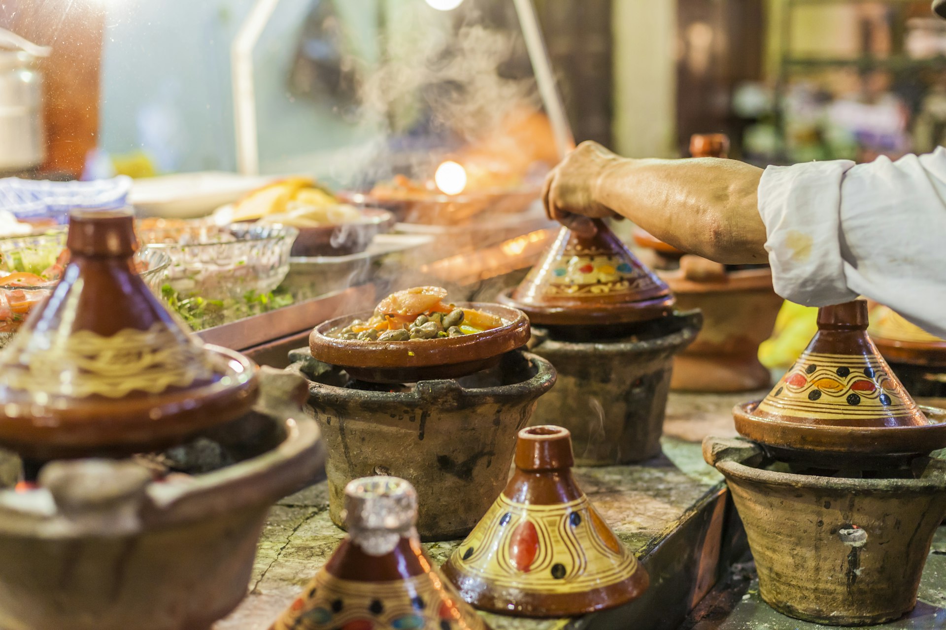 Selection of very colorful Moroccan tajines (traditional casserole dishes) in a Moroccan restaurant