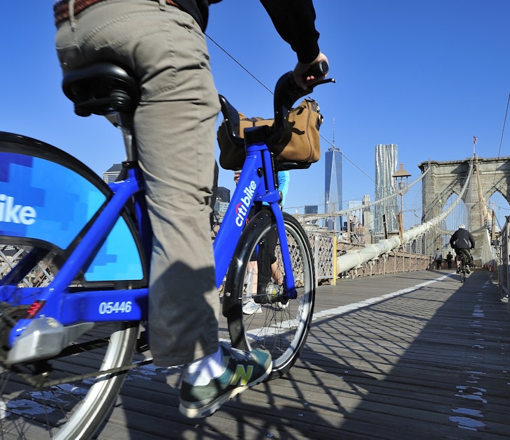 New York City, USA, - May. 19. 2014: Bike riders commuting to Manhattan by Citi Bike over Brooklyn Bridge. New York, USA; Shutterstock ID 213014248; your: Zach Laks; gl: 65050; netsuite: Online Editorial; full: Discover