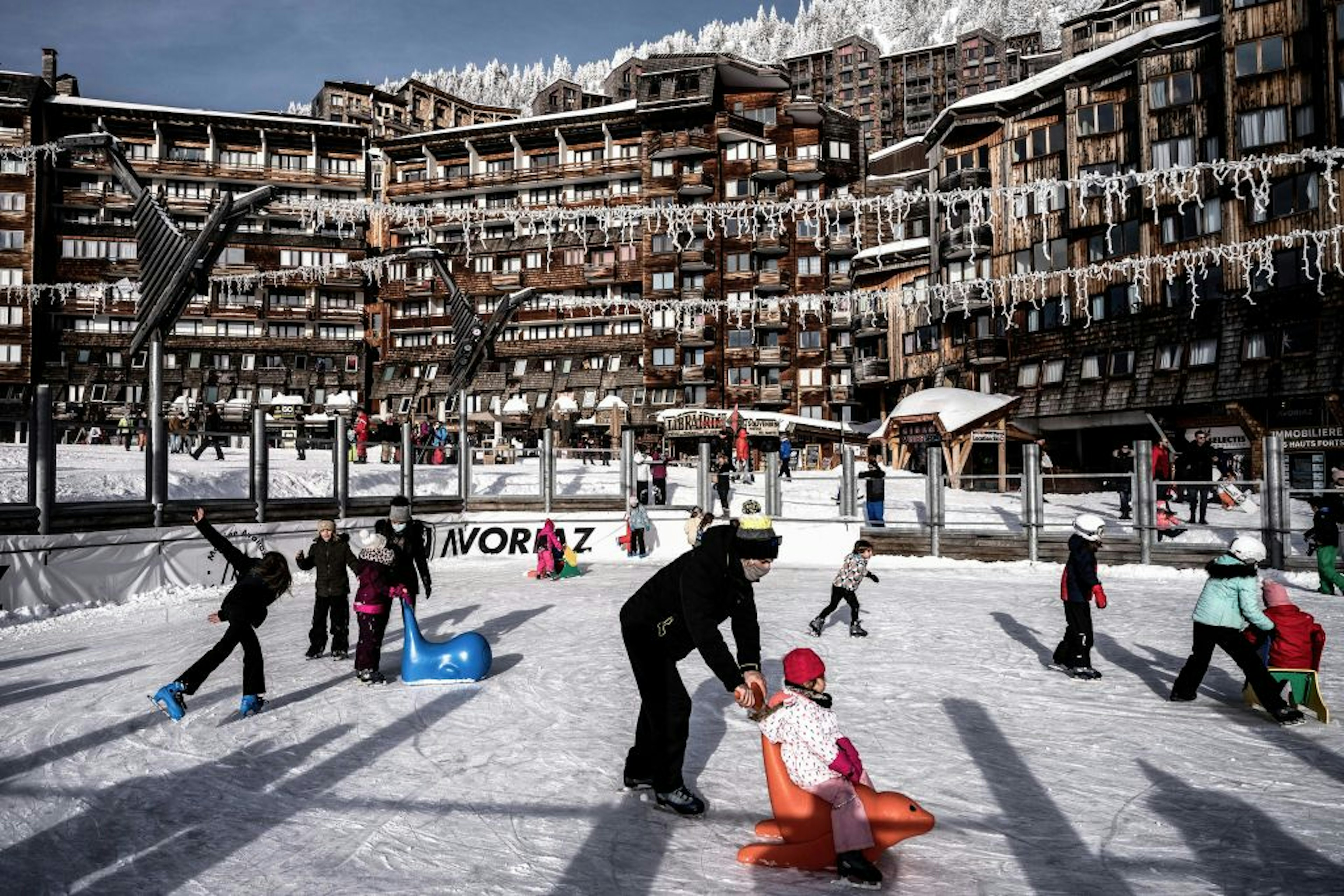 People enjoy the outdoor ice-skating rink at the Avoriaz ski resort