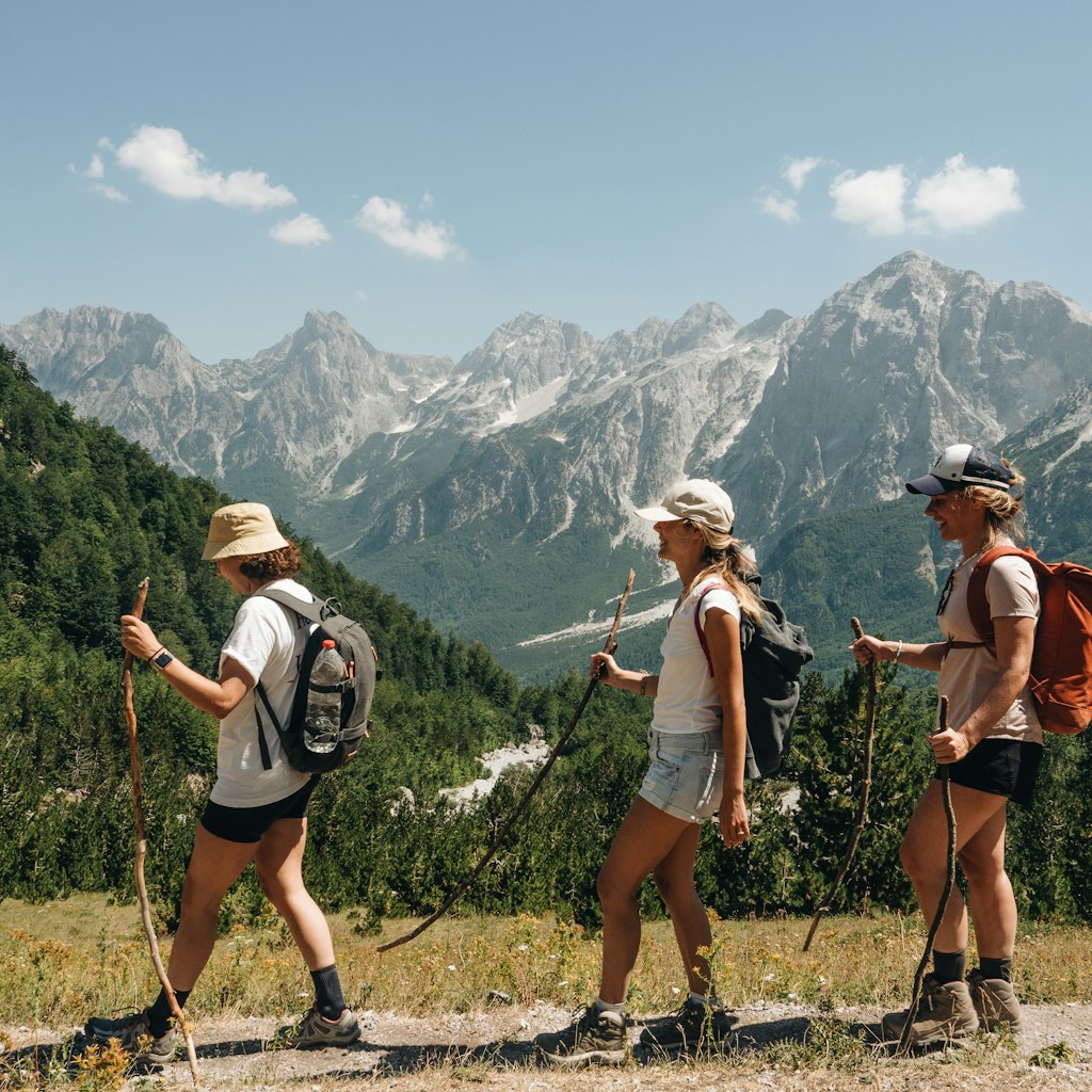 Hikers nearing the Valbona Pass in Albania's Accursed Mountains © Ilir Tsouko/Lonely Planet