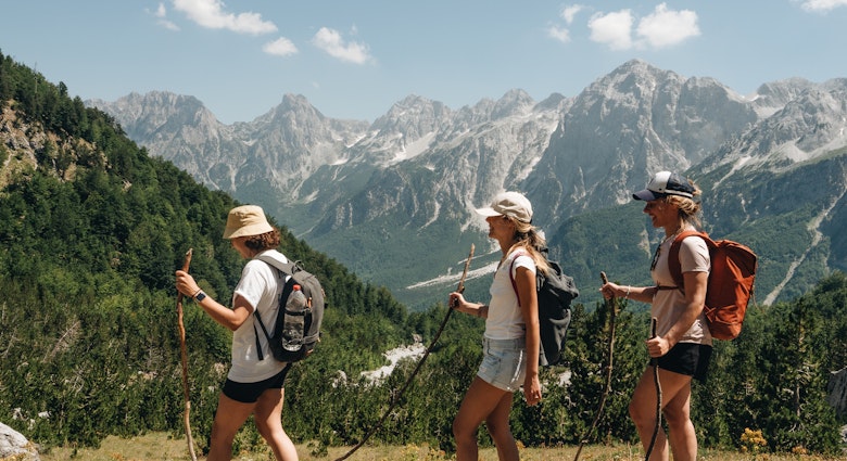 Hikers nearing the Valbona Pass in Albania's Accursed Mountains © Ilir Tsouko/Lonely Planet