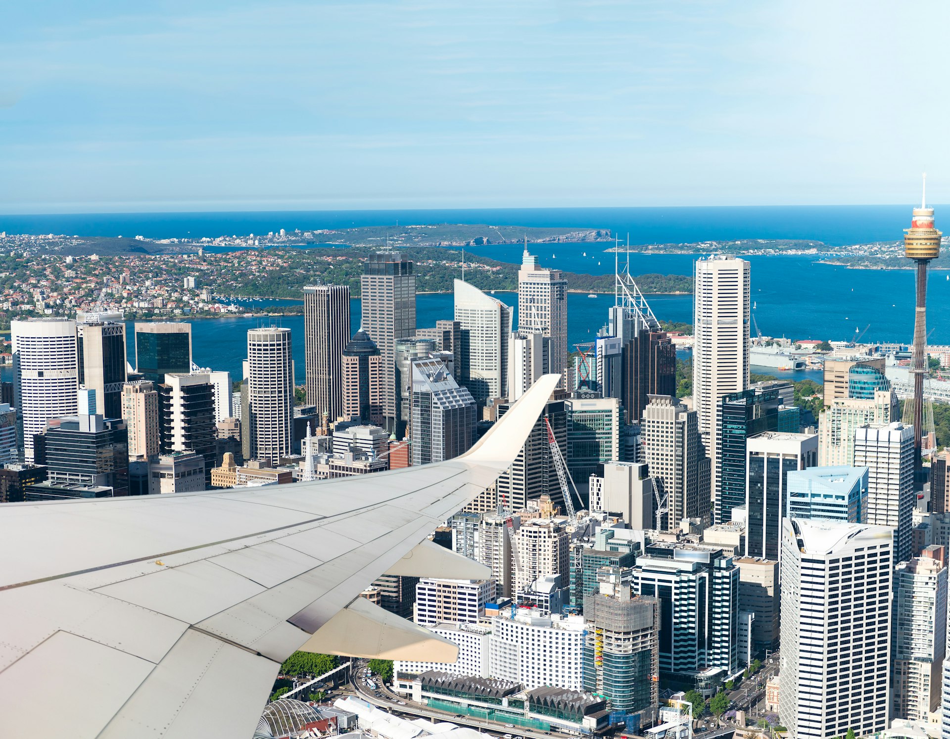 The towers of the Central Business District plus the aircraft’s wing photographed from an overhead passenger plane, Sydney, New South Wales, Australia