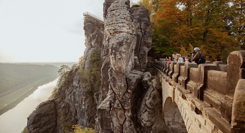 Visitors look out from Bastei near Dresden © Elizaveta Kovaleva/Lonely Planet