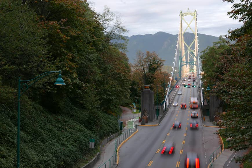 Blur motion of car driving on Lions Gate Bridge at Stanley Park in Vancouver BC Canada