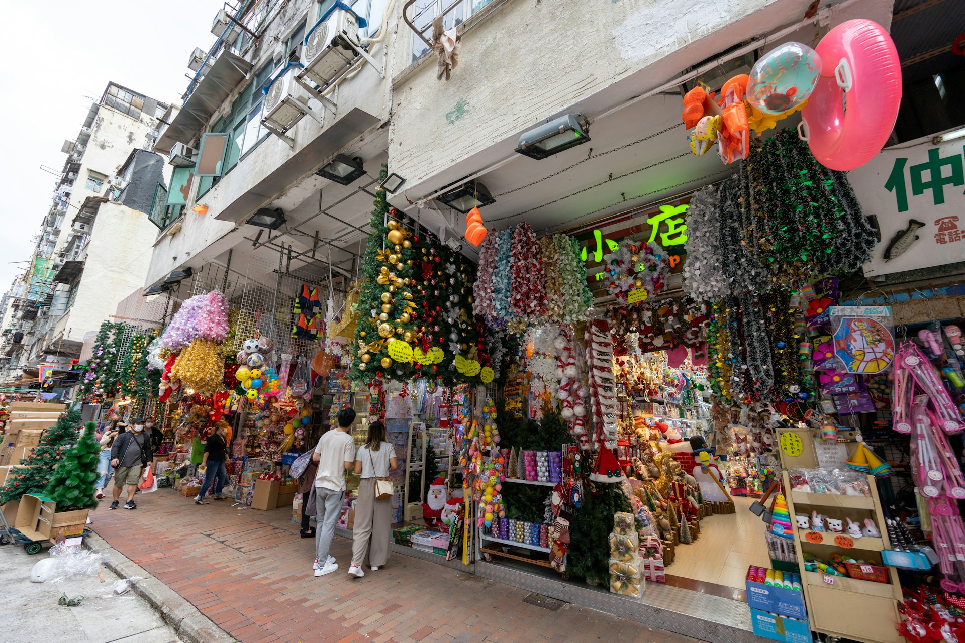 Christmas decorations, toys and bric-a-brac for sale outside stores in Hong Kong