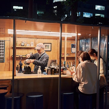Refuel by the Megane Coffee & Spirits yatai between tastings © Darien Robertson/Lonely Planet
