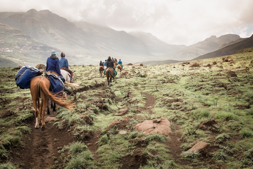 Horse riding group travels through the mountains of Lesotho.