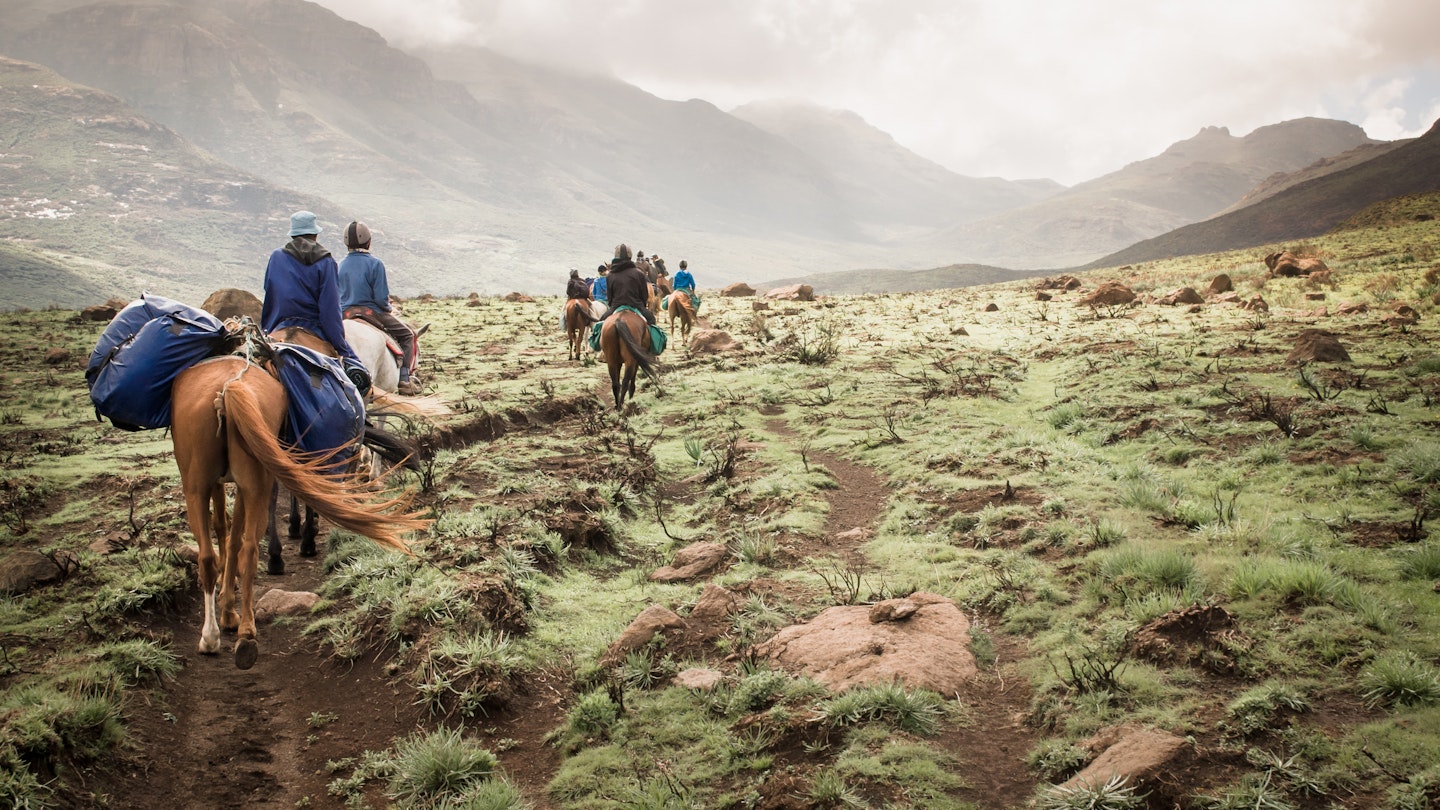 Horse riding group travels through the mountains of Lesotho.