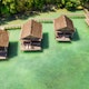 June 28, 2019 - Raja Ampat, Indonesia: High angle shot of the overwater bungalows along the coast of the Raja Ampat Islands in Indonesia