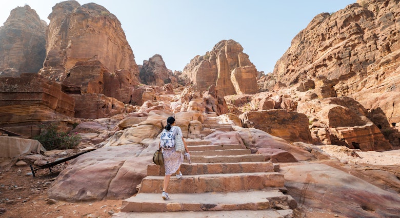 Female tourist at Petra famous archaeological site in Jordan's southwestern desert. Dating to around 300 B.C., it was the capital of the Nabatean Kingdom