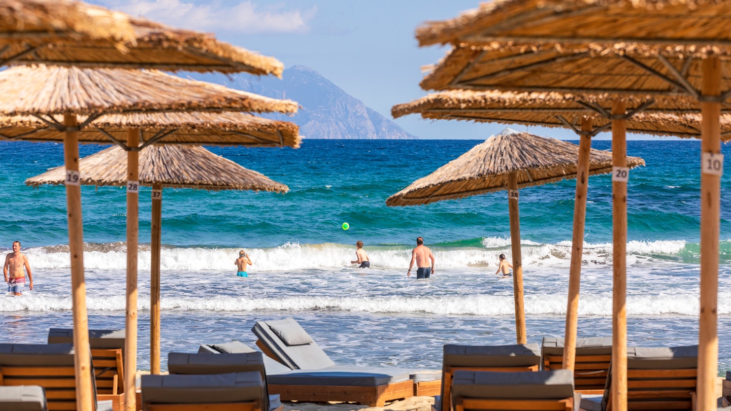 Sarti beach with Mount Athos in view © Konstantinos Tsakalidis/Lonely Planet