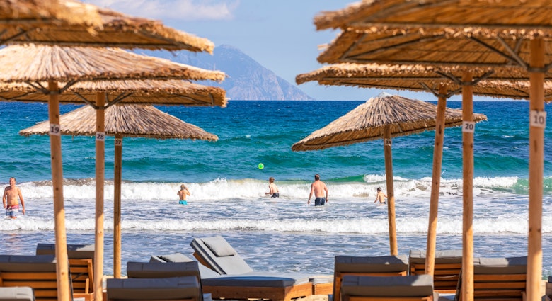 Sarti beach with Mount Athos in view © Konstantinos Tsakalidis/Lonely Planet