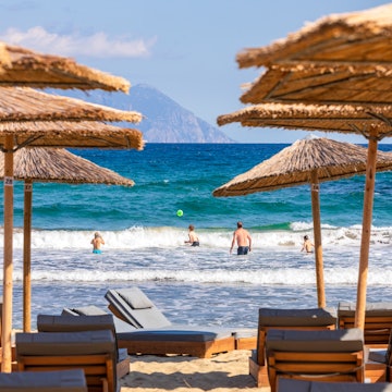 Sarti beach with Mount Athos in view © Konstantinos Tsakalidis/Lonely Planet