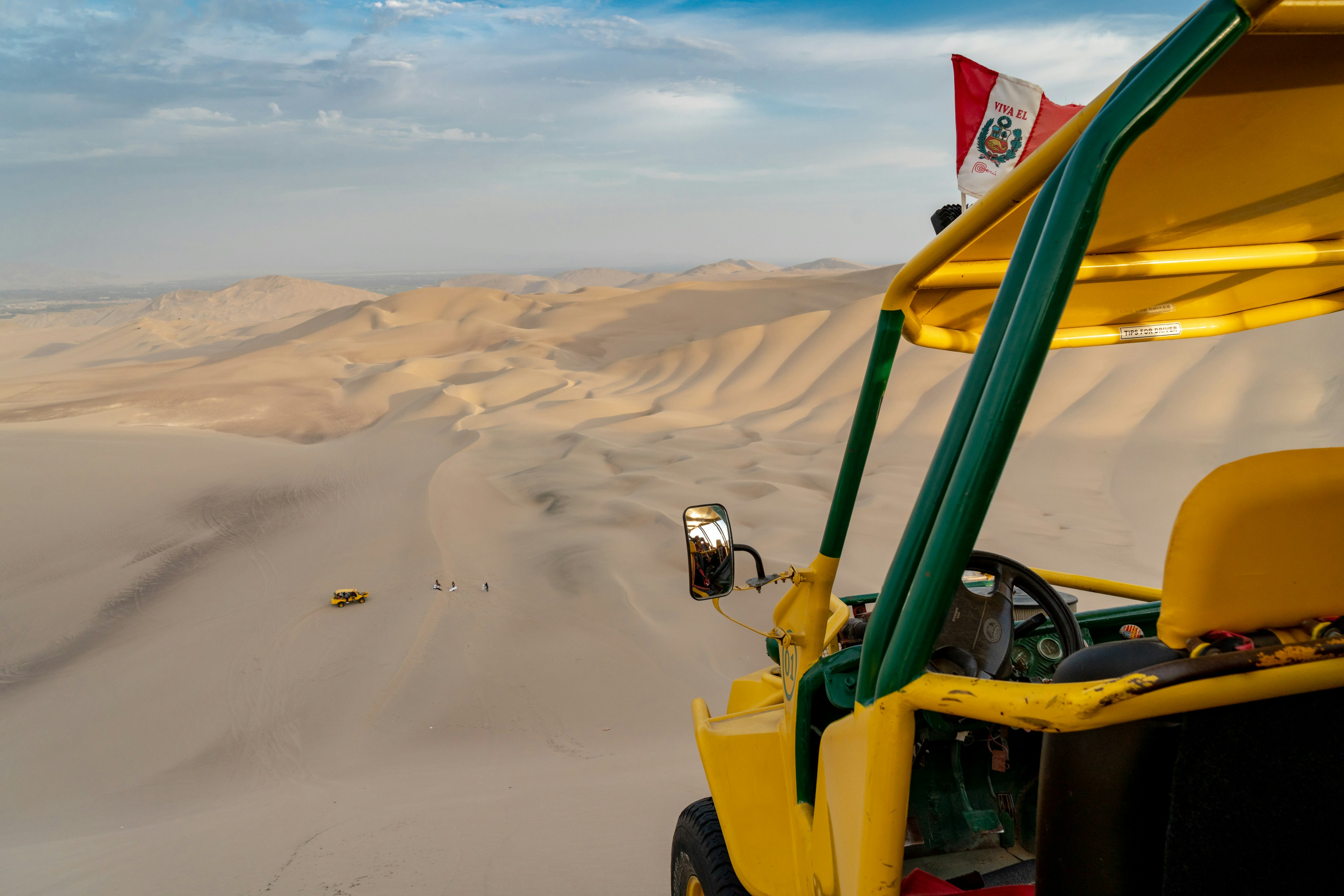 Beach buggy on sand dunes in Huacachina, Peru