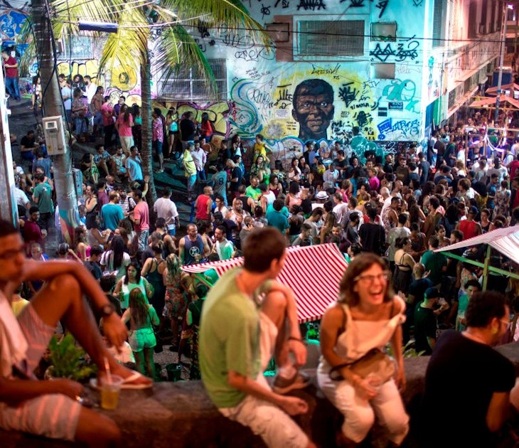 People attend a samba concert in the area of Quilombo Pedra do Sal, backdropped by a graffiti depicting Zumbi Dos Palmares - the main leader of Quilombo dos Palmares in Alagoas state during the colonial period and who became a symbol of the fight against slavery in the country- in downtown Rio de Janeiro, Brazil on December 18, 2017. .In Rio de Janeiro, three communities of descendants of slaves who broke chains from their masters cultivate the memory of their ancestral struggle. Unlike other "quilombos", they are amid the city and their current fight is against real estate speculation. / AFP PHOTO / MAURO PIMENTEL        (Photo credit should read MAURO PIMENTEL/AFP via Getty Images)
899383338
TOPSHOTS, Horizontal, CROWD, SAMBA, CONCERT, EFFIGY, SLAVERY
People attend a samba concert in the area of Quilombo Pedra do Sal, backdropped by a graffiti depicting Zumbi Dos Palmares - the main leader of Quilombo dos Palmares in Alagoas state during the colonial period and who became a symbol of the fight against slavery in the country- in downtown Rio de Janeiro, Brazil on December 18, 2017. In Rio de Janeiro, three communities of descendants of slaves who broke chains from their masters cultivate the memory of their ancestral struggle. Unlike other "quilombos", they are amid the city and their current fight is against real estate speculation. Rights managed: Full editorial rights UK, US, Ireland, Italy, Spain, Canada (not Quebec)