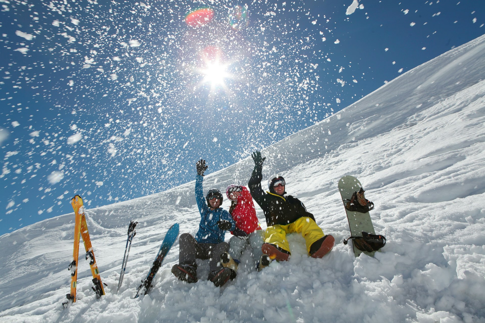 Friends throwing snow 