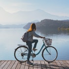 Young woman riding bicycle on Sun Moon lake bike trail, Travel lifestyle concept