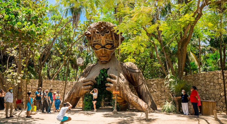 Tulum, Mexico. May 20, 2021.Beautiful towering wooden sculpture called "Ven a La Luz" welcomes guests onto the beach at Ahau Tulum in Mexico.; Shutterstock ID 1981632350; your: Ann Douglas Lott; gl: 65050; netsuite: Digital Content; full: Tulum beaches article refresh