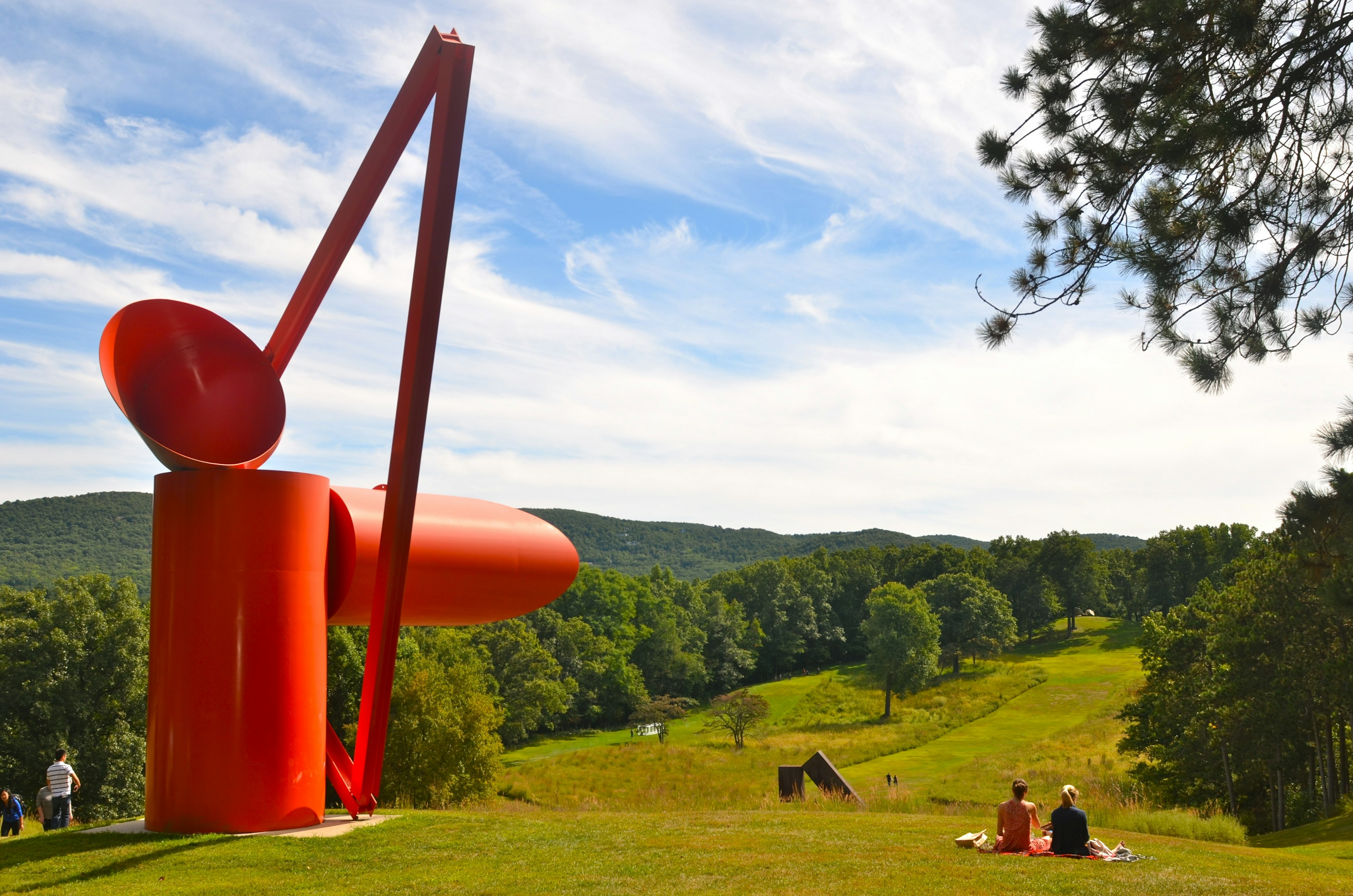 Visitors relaxing near huge artworks at the Storm King Art Center, New Windsor, NY