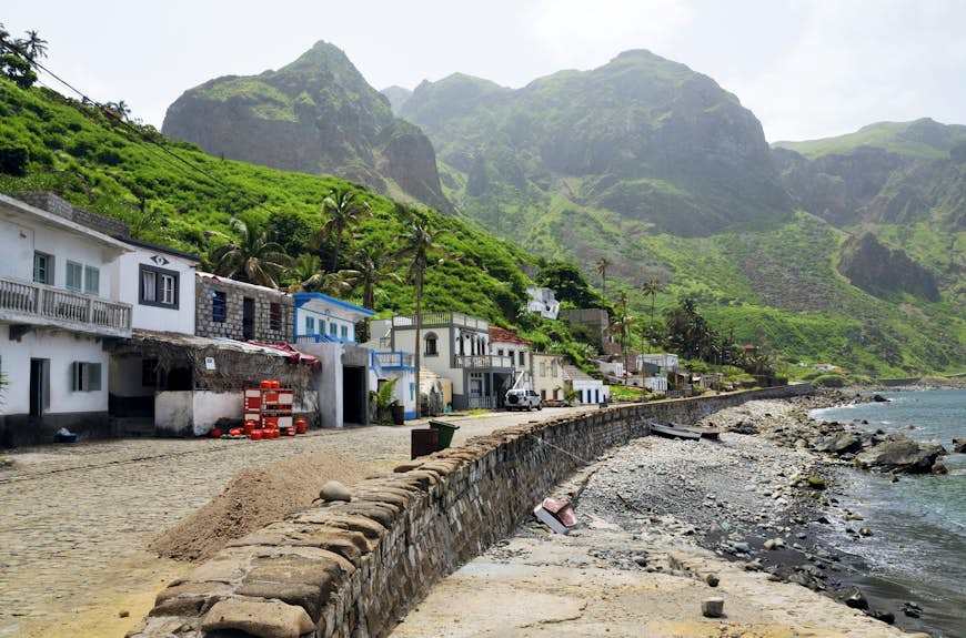 Homes and business align the oceanfront cobblestone street in Cabo Verde