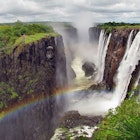 Rainbow over Victoria Falls on Zambezi River 