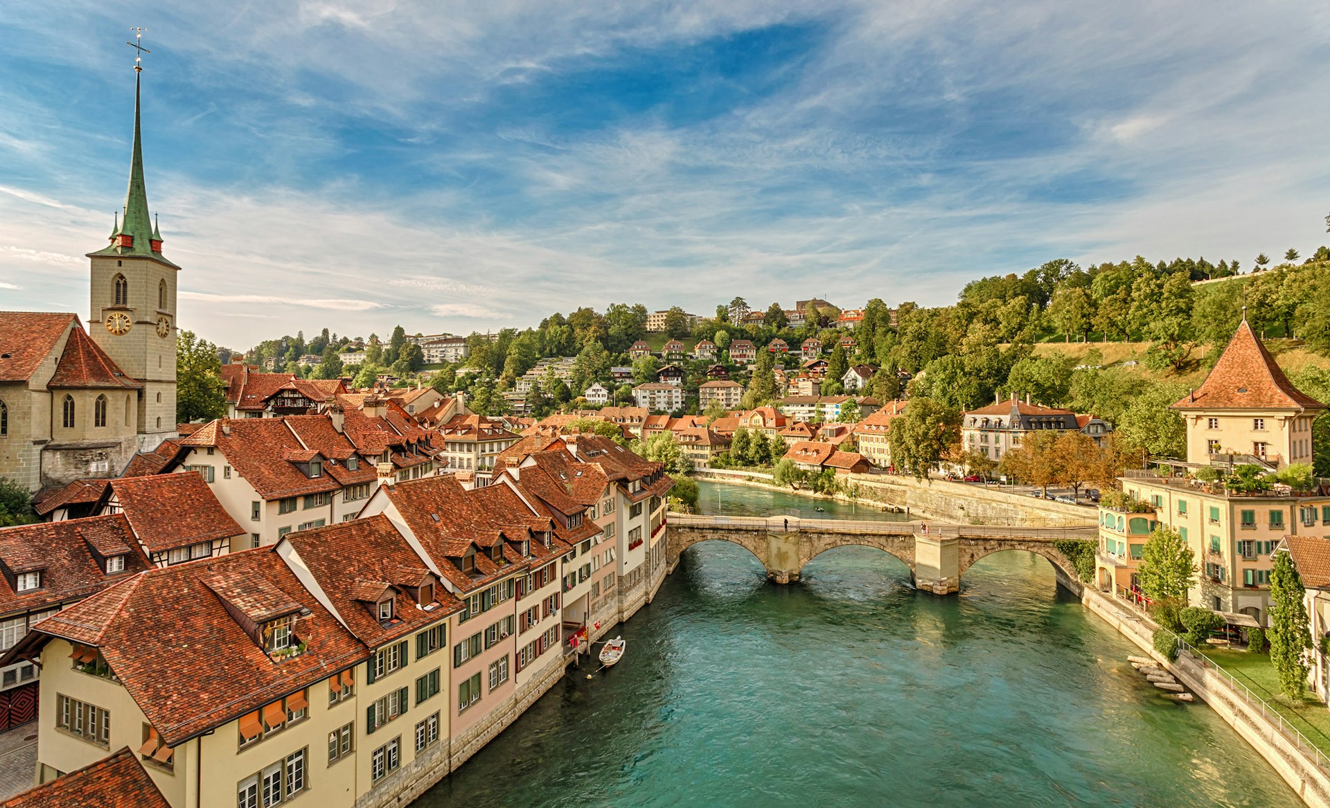 A city old town with a turquoise river running through it