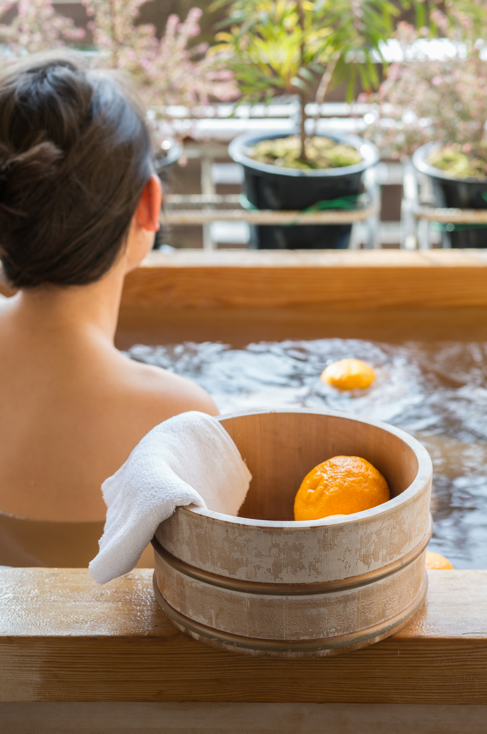 Bath bucket with yuzu during traditional bathing at Japanese onsen