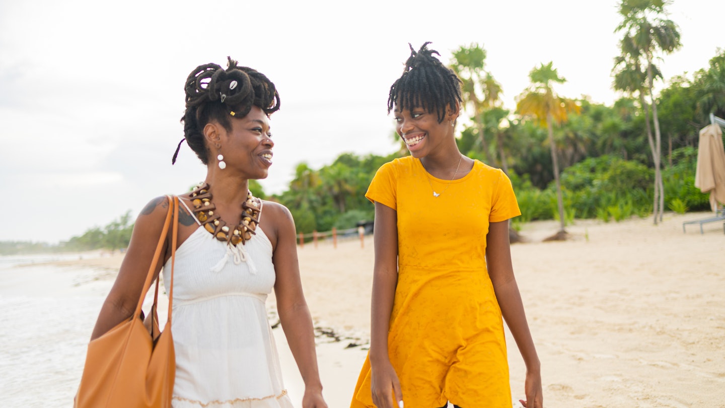Mother and daughter are having a lovely day at the beach. They are enjoying the long afternoon walk
1444989340