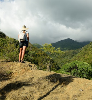 874347174
climb, expedition, treking, travels, woman, sierra maestra, coast, trail, top, pico turquino, palm, cubana, clouds, highlands, country, landmark, stone, green, scenic, background, beautiful, countryside, plants, scene
Tourist no the trail for the highest peak on Cuba Pico Turquino being in a mountain range Sierra Maestra on Cuba