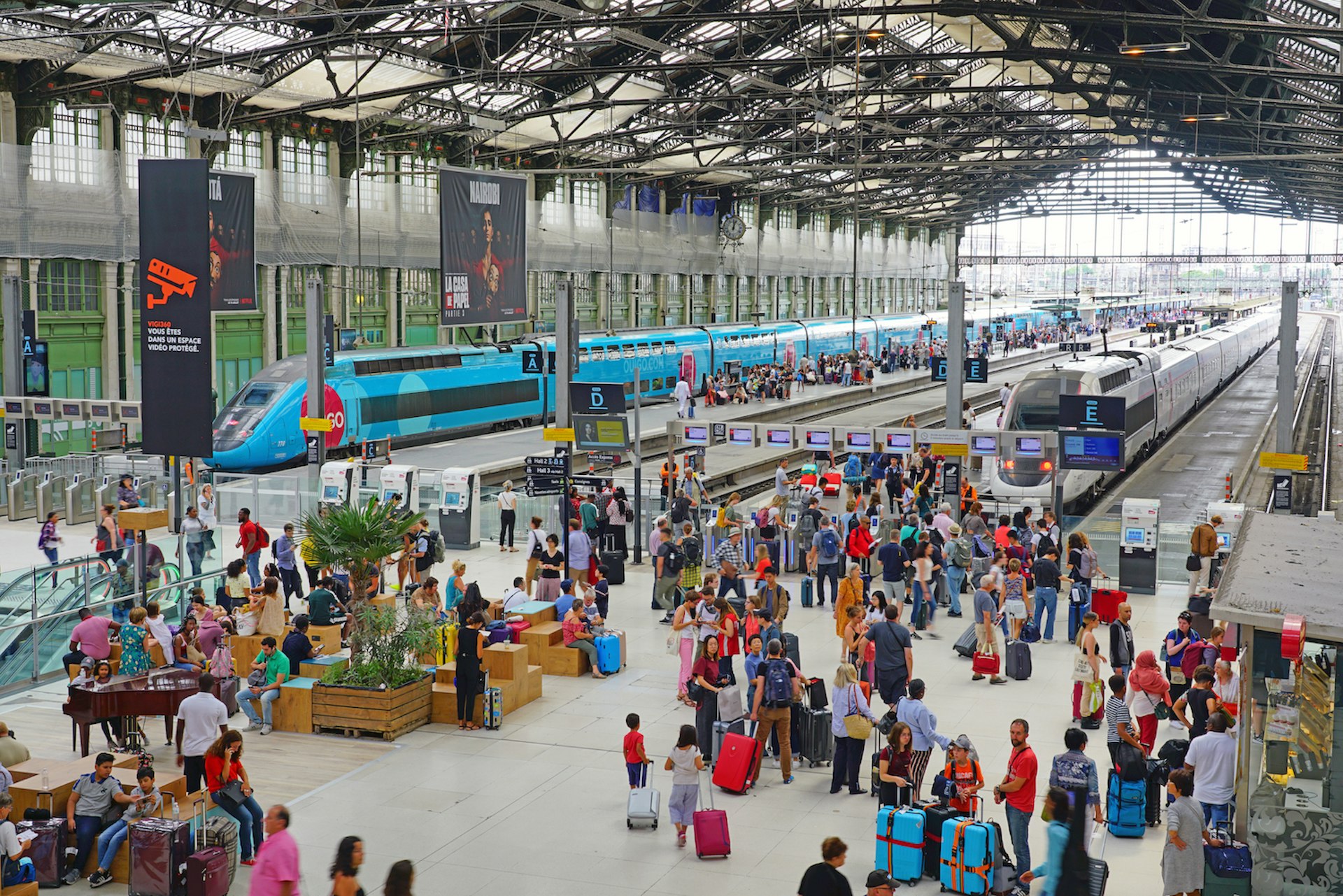 View of trains and passengers at the historic Gare de Lyon train station, Paris, France