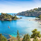 Isola Bella is small island near Taormina, Sicily, Italy. Narrow path connects island to mainland Taormina beach in azure waters of Ionian Sea. ; Shutterstock ID 1760426138; your: Brian Healy; gl: 65050; netsuite: Lonely Planet Online Editorial; full: 10 