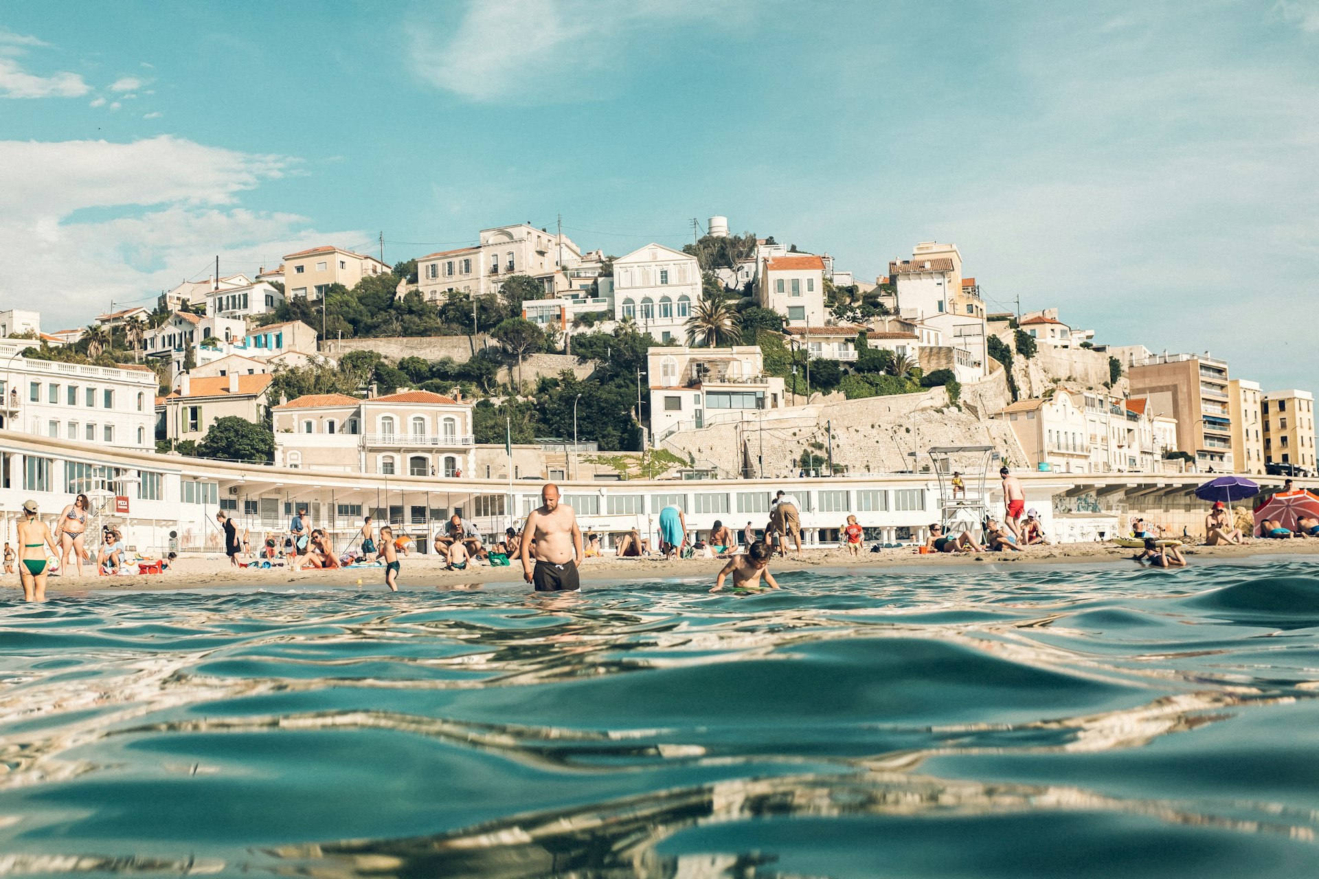 Bathers in the Mediterranean at Les Prophètes beach, Marseille, Côte d’Azure, France