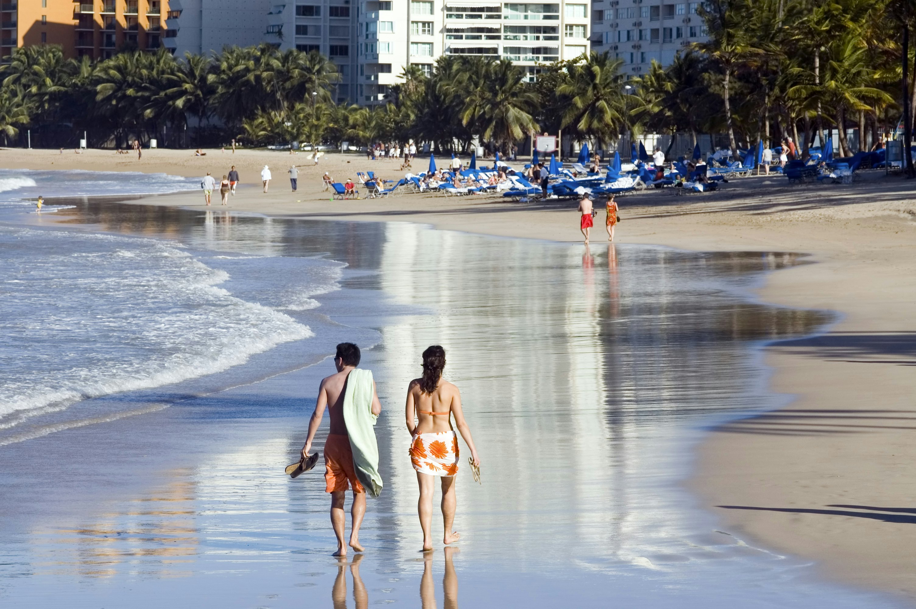 A couple walking on the beach in San Juan, Puerto Rico