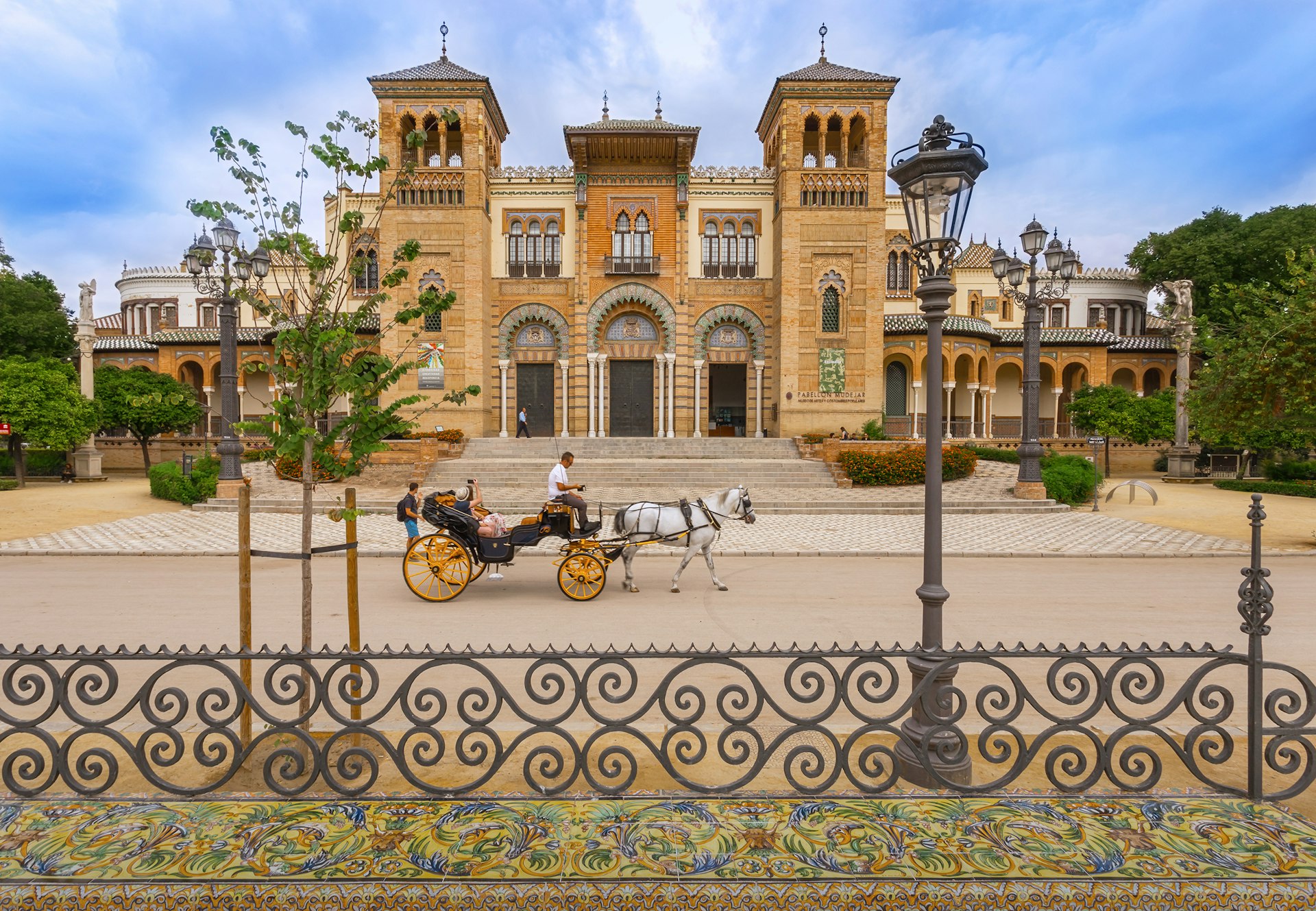 A horse-drawn carriage in front of a building in Seville. 