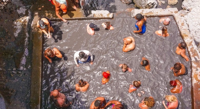 Soufriere, Saint Lucia - May 12, 2016: The tourists swimming at the Sulphur Springs Drive in volcano near Soufriere on 12 may 2016 at Saint Lucia island
871361558