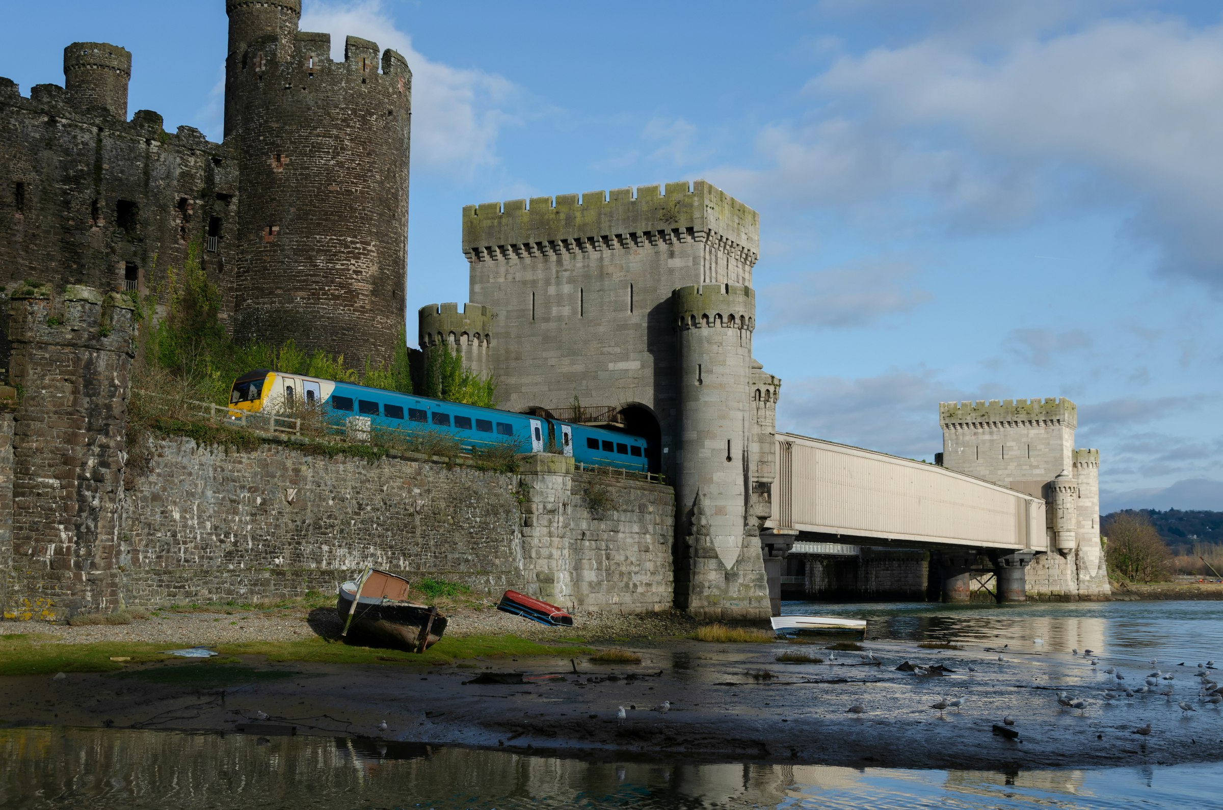 A train passes Conwy Castle, Wales, United Kingdom