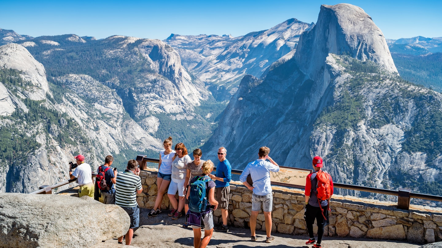 Visitors enjoy the view from Glacier Point lookout in Yosemite National Park, California, USA on a sunny day.
1133650354
california, national park, yosemite national park, yosemite valley, blue, glacier point, nature, outdoors, people, sky, sunny, viewpoint, visit, tourist, tourism, rock - object, mountain, mountain range, landscape - scenery, famous place, travel destinations, scenics - nature, travel, beauty in nature, group of people, valley, clear sky, large group of people, western usa, half dome, californian sierra nevada