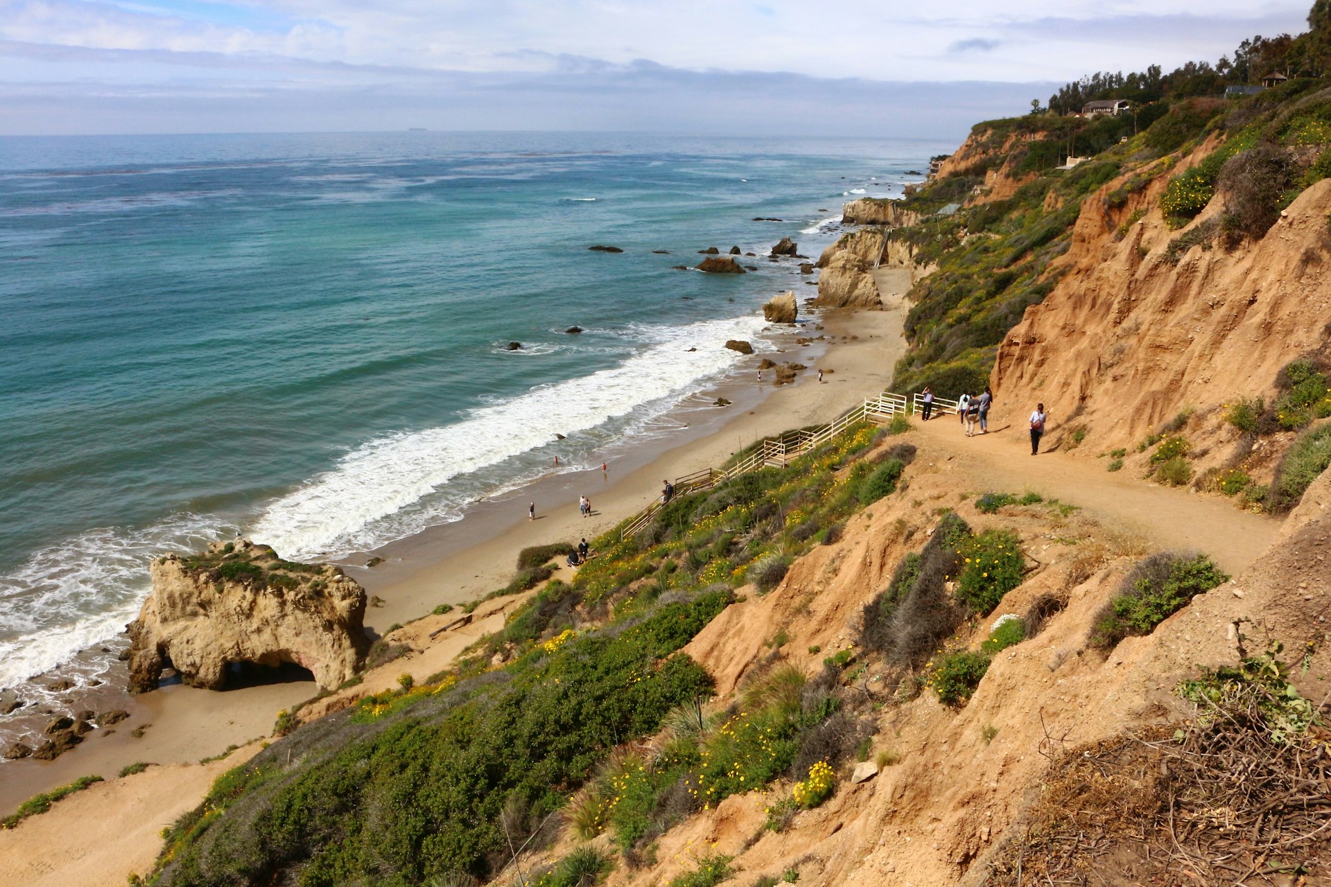 People on the pathway to the beach at El Matador State Beach in Malibu