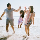 A cute young family walks along the sand by the Santa Monica Pier in Los Angeles, California. The father and mother hold their daughters hands, lifting her up when the waves come in. A much needed break from the city in the ocean air.
1266365034